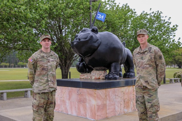U.S. Army 1st Lt. David Stanley and 1st. Lt. Zachary Hobson, both infantry officers assigned to 1st Armored Brigade Combat Team, 3rd Infantry Division, pose by 3rd ID’s Rocky statue, March 31, 2021, on Fort Stewart, Georgia. Both Soldiers are currently training for the 37th Annual Best Ranger Competition slated to take place April 16-18 at Fort Benning, Georgia. (U.S. Army photo by Pfc. Summer Keiser)