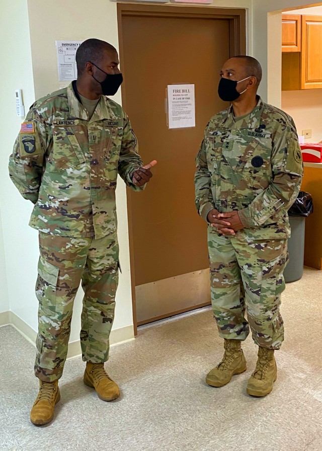 Maj. Gen Reginald G. Neal (right), the U.S. Army Pacific Deputy Commanding General receives a Contingency Command Post technical brief of the Tactical Network Monitoring System from Chief Warrant Officer 3 Quintin Lawrence (left), the system technician & security advisor, 311th Signal Command (Theater).
