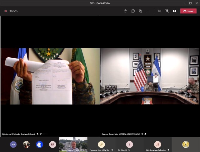 Col. Mario Adalberto Figueroa Cárcamo (left), Salvadoran Army chief of staff, shows his signed copy of the agreed-to-actions document between the U.S. and Salvadoran armies April 7 outlining future training commitments and professional exchanges...