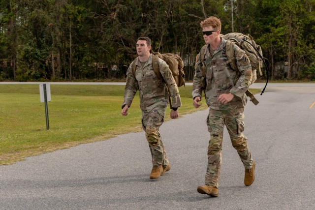 U.S. Army 1st Lt. David Stanley and 1st Lt. Zachary Hobson, both infantry officers assigned to 1st Armored Brigade Combat Team, 3rd Infantry Division, sprint to finish a 24-mile ruck march, April 9, 2021, on Fort Stewart, Georgia. Both lieutenants, who were deployed in South Korea, traveled to Georgia to participate in the Best Ranger Competition, slated to take place April 16-18 at Fort Benning, Georgia, and are in team 3 of the competition.  (U.S. Army photo by Pfc. Summer Keiser)