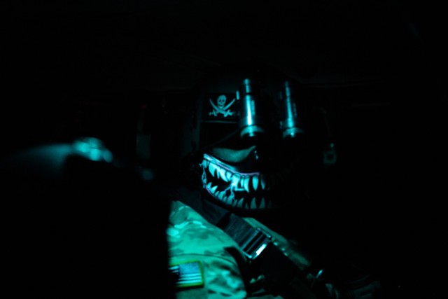 Sgt. Christopher Armenta with C Company, 1st Assault Helicopter Battalion, 140th Aviation Regiment, Washington National Guard, prepares for night fire during aerial gunnery qualifications at Fort Sill, Oklahoma, March 30, 2021.