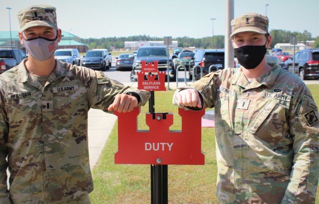 U.S Army 1st Lt. Andrew Wilhelm and 1st Lt. Madison Jones, both assigned to 92nd Engineer Battalion, pose in front of Army Values signs on Fort Stewart, Georgia, April 7, 2021. These lieutenants are slated to compete in the Army’s Best Sapper...