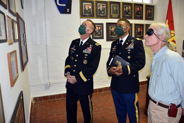 Lt. Gen. Daniel Karbler, U.S. Army Space and Missile Defense Command commanding general, and Col. Samuel Glover, USASMDC deputy chief of staff, G-8, look at the Army Space and Missile exhibit at the Fayetteville-Lincoln County Museum with Lincoln...