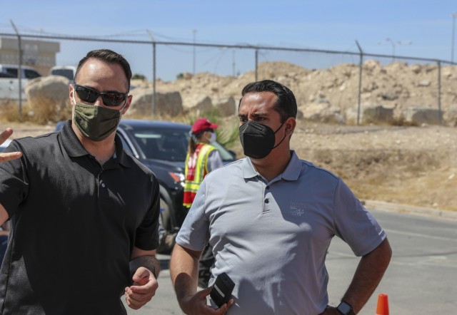 Health and Human Services Director Fabian Solis (right) speaks with Sgt. Daniel Sheahan with Joint Task Force 17 about operations at the mobile vaccination unit site, Tuesday, April 6, 2021 at the Paiute Indian Tribe in Las Vegas, Nevada.