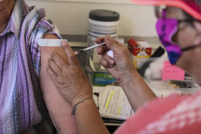 Susan Vilardi, vaccine supervisor with the Nevada mobile vaccination unit, administers the one-shot Janssen vaccine to a local resident, Thursday, Apr. 8, 2021 in Pahrump, Nevada.