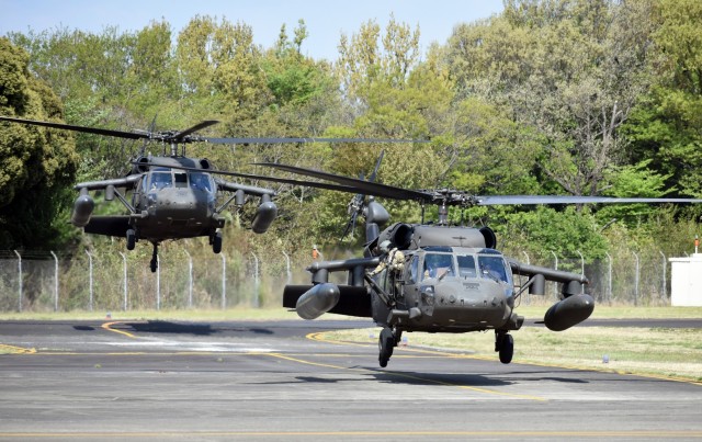 Black Hawk helicopters carrying cadets come in for a landing during the Zama Middle High School Junior Reserve Officers’ Training Corps Cadet Leadership Challenge at Kastner Army Airfield, April 8.