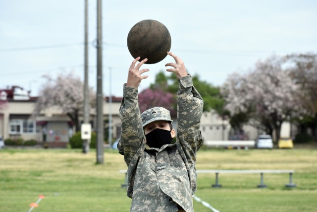 Cadet Cpl. Bryson Gummerus completes the standing power throw portion of the Army Combat Fitness Test during the Zama Middle High School Junior Reserve Officers’ Training Corps Cadet Leadership Challenge at Camp Zama, Japan, April 6.