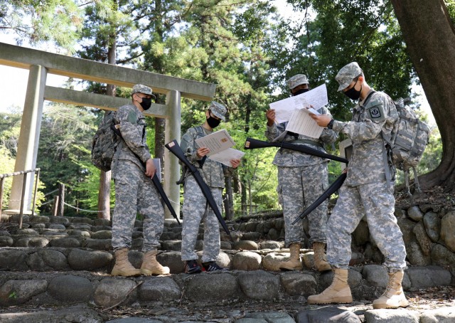 From left, Cadet Master Sgt. Bryan Ponce; Cadet Cpt. Bryson Gummerus; Cadet Pvt. Timothy Armstrong; and Cadet Sgt. Anthony Escalera work on the orienteering portion of the Zama Middle High School Junior Reserve Officers’ Training Corps Cadet...