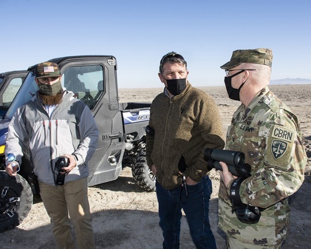 After the firing of a missile (which cannot be shown for security reasons), Col. Scott Gould, Commander of Dugway Proving Ground (right) discusses the test with (left) Derek Schumann, Project Test Officer for the Special Programs Division of DPG’s West Desert Test Center; and Randy Gibson, Chief of Test Management for Special Programs Division.
