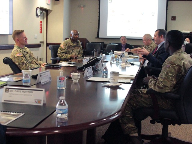 Maj. Gen. Darren Werner (left), Commanding General U.S. Army Tank-automotive and Armaments Command, hosted Chris Bushell (directly across), Director General Land of the U.K. Ministry of Defence, at the Detroit Arsenal, Michigan Apr. 13.  The two leaders met to discuss the similarities in mission of both leaders and potential areas where they could provide mutual benefit.