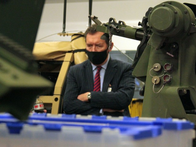 Chris Bushell, Director General Land for U.K. Ministry of Defence, views the Robotic Combat Vehicle-Light, during a tour of Ground Vehicle Systems Center at the Detroit Arsenal Apr. 13.  Bushell toured many of GVSC’s facilities seeing a variety of robotic, semi-autonomous, and experimental vehicles.