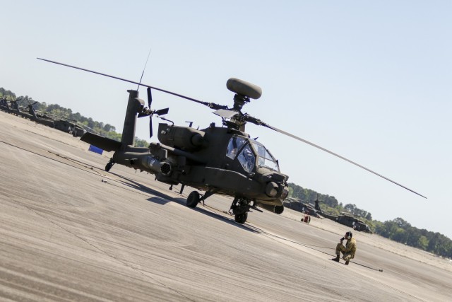 An AH-64E Apache helicopter sits on the flight line at Hunter Army Airfield, Georgia, Apr. 12. Pilots assigned to the 3rd Squadron, 17th Cavalry Regiment, 3rd Combat Aviation Brigade, 3rd Infantry Division, conducted familiarization training on the aircraft as the until transitions to the newer E model from the older D model. The AH-64E Apache is designed to increase power margins and reliability which increases unit readiness and lethality. (U.S. Army photo by Spc. Savannah Roy, 3rd Combat Aviation Brigade, 3rd Infantry Division)
