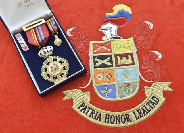 The “Fe en la Causa” medal, translated as “Faith of the Cause,” presented to Brig. Gen. Douglas Lowrey, commander of U.S. Army Security Assistance Command, at the Canton Norte base in Bogota, Colombia, 8 April 2021. This medal was created to honor members of the Colombian Army who have been distinguished for their outstanding service, as well as to honor foreign military members who have earned the gratitude of the national army of Colombia. Brig. Gen. Lowrey was presented the medal as the leader of an organization that has been a critical component to the success and modernization of the Colombian Army over the past decades. (U.S. Army photo by Richard Bumgardner)