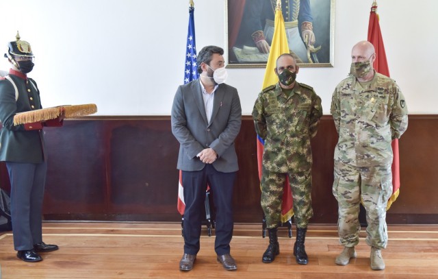 The Colombian Vice Minister of Defense, Jairo Garcia Guerrero, left, along with Gen. Eduardo Zapateiro, the Colombian National Army commanding general, prepare to present the 'Faith in the Cause' medal to Brig. Gen. Douglas Lowrey, commander of U.S. Army Security Assistance Command, at the Canton Norte base in Bogota, Colombia, 8 April 2021. This medal was created to honor members of the Colombian Army who have been distinguished for their outstanding service, as well as to honor foreign military members who have earned the gratitude of the national army of Colombia. Brig. Gen. Lowrey was presented the medal as the leader of an organization that has been a critical component to the success and modernization of the Colombian Army over the past decades. (U.S. Army photo by Richard Bumgardner)