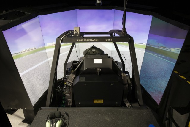 An Apache Pilots assigned to the 3rd Squadron, 17th Cavalry Regiment, 3rd Combat Aviation Brigade, conducts familiarization training on the AH-64E Apache helicopter in a flight simulator at Hunter Army Airfield, Georgia, April 1. The brigade fielded the AH-64E which replaced the older AH-64D. The AH-64E Apache helicopter is designed to increase power margins and reliability which increases unit readiness and lethality. (U.S. Army photo by Sgt. Andrew McNeil, 3rd Combat Aviation Brigade, 3rd Infantry Division)