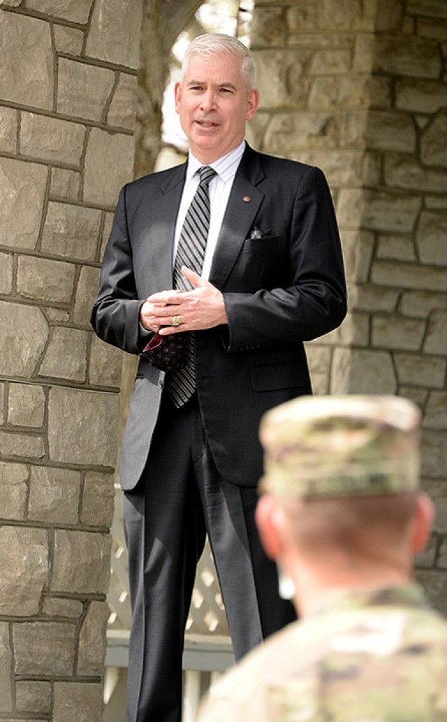 Richard Creed, director of the Combined Arms Doctrine Directorate, offers a little background and context for the Order of Martin of Tours during a ceremony to present the award to Catholic Chaplain (Maj.) Jason Hesseling, CADD religious support...