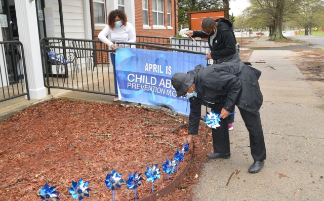 Staff members of the Fort Lee Family Advocacy Program set up signage and their annual pinwheel garden display by the front entrance of the Army Community Service facility to mark the start of Child Abuse Prevention Month on April 1. Pictured from...