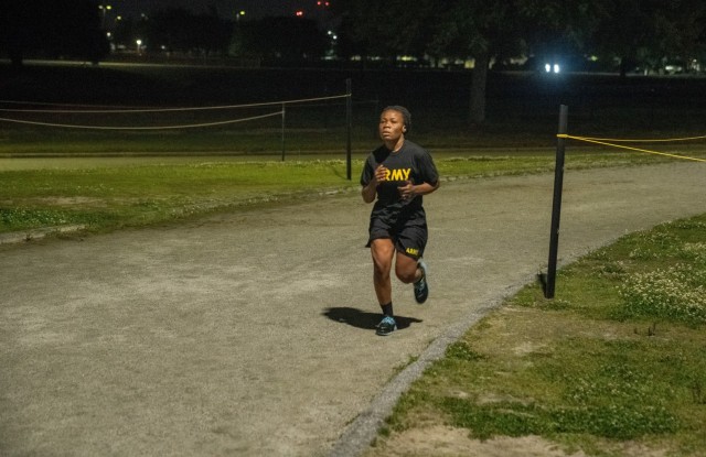 LT Agatha Kpamina, an officer with the Ghana Armed Forces, runs 5 miles on the track at Stewart-Watson Field, Fort Benning, Georgia.