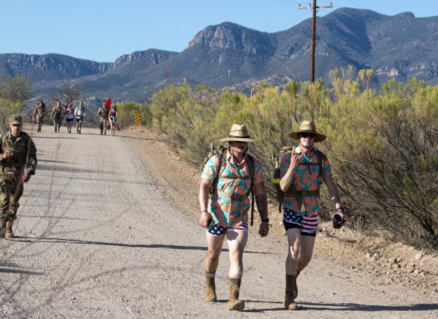 Pvt. 1st Class Noah Frohn and Spc. Jonathan Sherman, both active duty, military intelligence students, B Company, 305th Military Intelligence Battalion, competed together on the 26.2-mile 2021 Bataan Memorial Death March sponsored by the 111th Military Intelligence Brigade and the Directorate of Family, Morale, Welfare and Recreation on April 10 at Brown Parade Field, Fort Huachuca, Ariz. The Bataan Memorial Death March is a challenging and grueling march that tests both mental and physical abilities. For the 2021 virtual experience, marchers can choose between the full 26.2-mile marathon length or a 14.2-mile honorary distance.