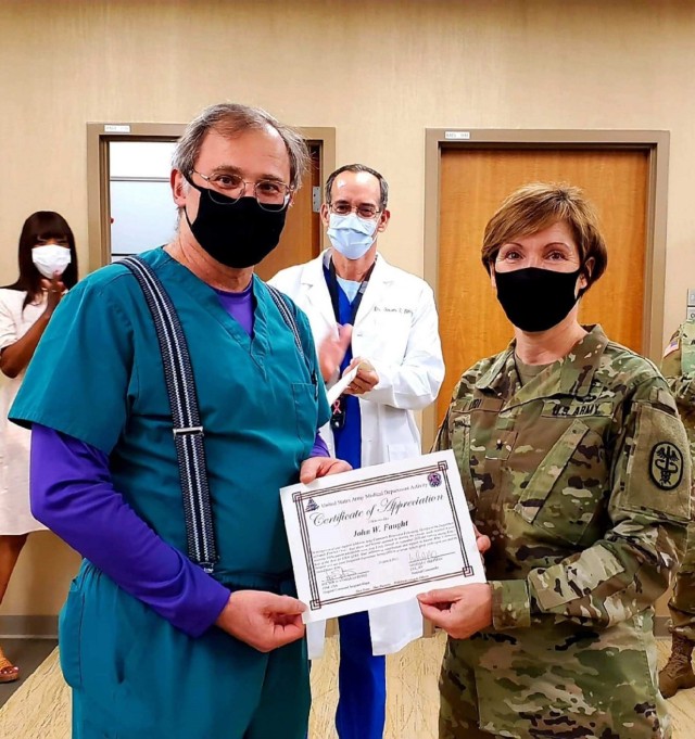 Martin Army Community Hospital Family Medical Home Medical Director Dr. John Faught recognized by Regional Health Command Atlantic Commander Brig. Gen. Paula Lodi for his efforts fighting COVID-19.