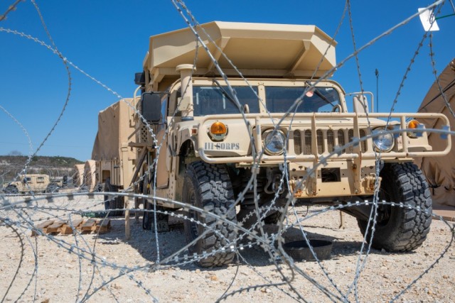 A III Corps Humvee sits behind a concertina wire barrier during Warfighter 21-4 March 29, 2021, at Fort Hood, Texas. U.S. III Corps, the French 3rd Division and the United Kingdom’s 3rd Division worked together to conduct the exercise.