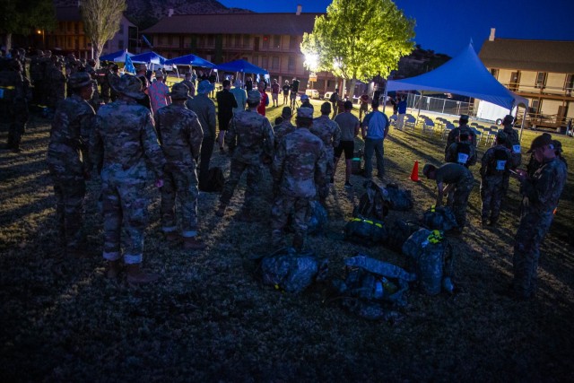 More than 250 Soldiers and civilians assembled on Brown Parade Field here beginning at 4 a.m. April 10, for the opening ceremony of the 2021 Bataan Memorial Death March sponsored by the 111th Military Intelligence Brigade and the Directorate of Family, Morale, Welfare and Recreation. The Bataan Memorial Death March is a challenging and grueling march that tests both mental and physical abilities. For the 2021 virtual experience, marchers can choose between the full 26.2-mile marathon length or a 14.2-mile honorary distance.