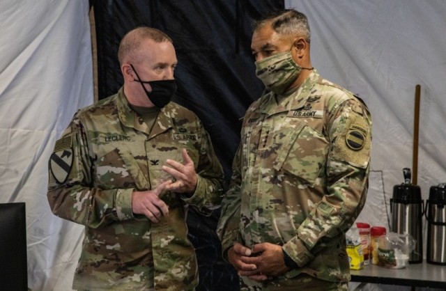 Gen. Michael Garrett, U.S. Army Forces Command commanding general, visits the III Corps headquarters tent to receive a briefing during Warfighter Exercise 21-4 April 7, 2021, at Fort Hood, Texas. Warfighter 21-4 was a military training event that challenged senior commanders and staffs in a computer-driven battlefield simulation