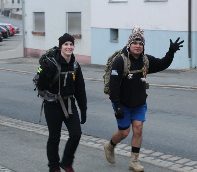Capt. Rachel Zarnke and Staff Sgt. Yonathan Roblesbarrios take part in the with take part 32nd Annual Bataan Death March-Virtual Edition here in Grafenwoehr, Germany on April 17, 2021 along with their fellow Soldiers in 1st Battalion, 77th Field Artillery Regiment. (Official U.S. Army photo by Capt. Paul Dyer)