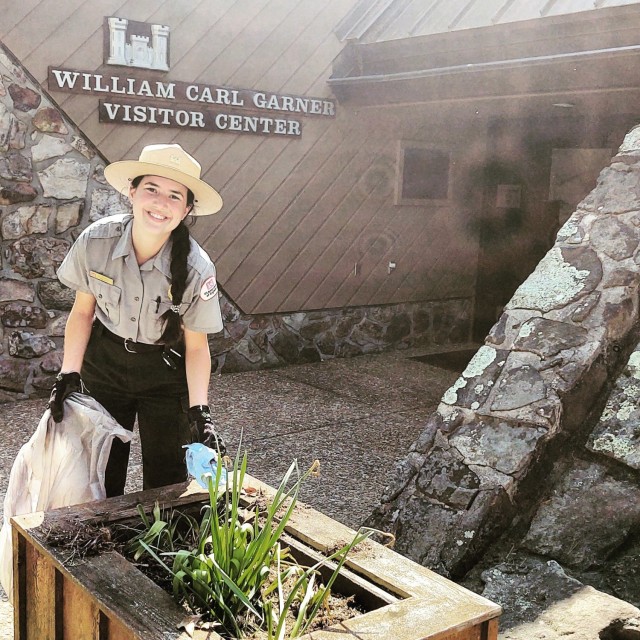 Ranger Mary Simmons picks up trash for Earth Day at Greers Ferry Lake.