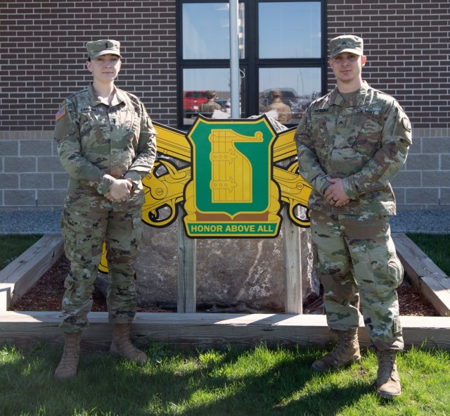 Cpl. Joseph DeSena and 1st Lt. Melissa Campbell of Headquarters and Headquarters Detachment, 91st Military Police Battalion, 10th Mountain Division (LI) stand outside of the 91st MP Battalion Headquarters April 19, 2020, at Fort Drum, N.Y. The two Soldiers intervened in a potential domestic violence incident on Route 3 in Black River, N.Y. on March 7th, 2021. (U.S. Army photo by Pfc. Anastasia Rakowsky)