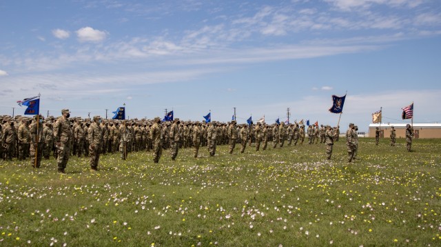 Task Force Phoenix units display their colors during a deployment ceremony after all mobilization training requirements were completed at North Fort Hood, Texas, April 18, 2021. During the ceremony, the colors of each unit within the Task Force were cased and put in a protective sheath in preparation for the Brigade&#39;s movement overseas. 