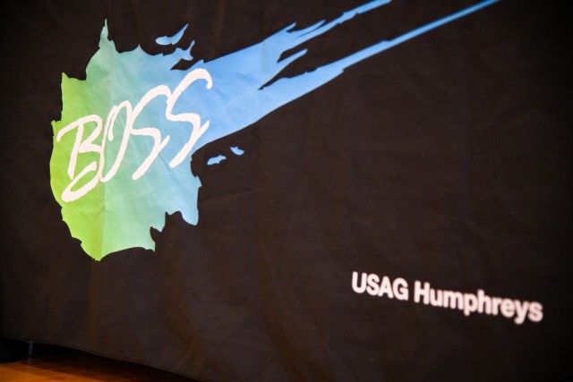 CAMP HUMPHREYS, Republic of Korea - A Better Opportunities for Single Soldiers (BOSS) logo is shown on a tapestry during an awards ceremony here, March 24. The BOSS team has dedicated countless hours of preparation for their upcoming Sexual...