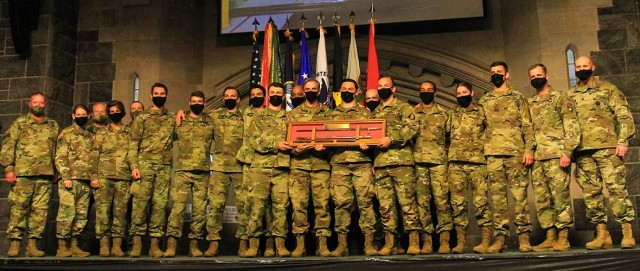 The USMA Black team holds the Reginald E. Johnson Memorial Saber marking its team victory at the post event ceremony.