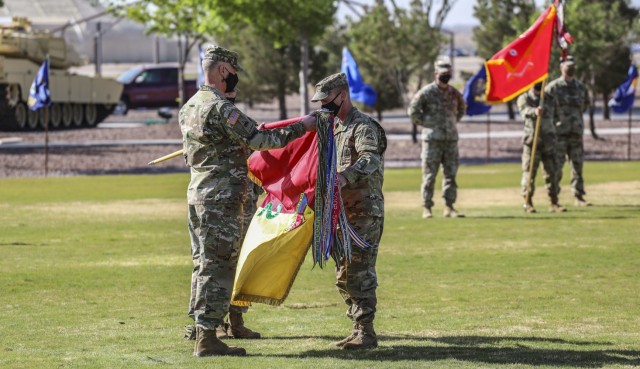 The 2nd Armored Brigade Combat Team, ‘The Iron Brigade’, 1st Armored Division uncased their unit colors during a ceremony on Iron Soldier Field April 22. The ceremony marked the end of their deployment in support of Operation Spartan Shield and reintegration back into the Fort Bliss community. (U.S. Army Photo by: Staff Sgt. Michael West)