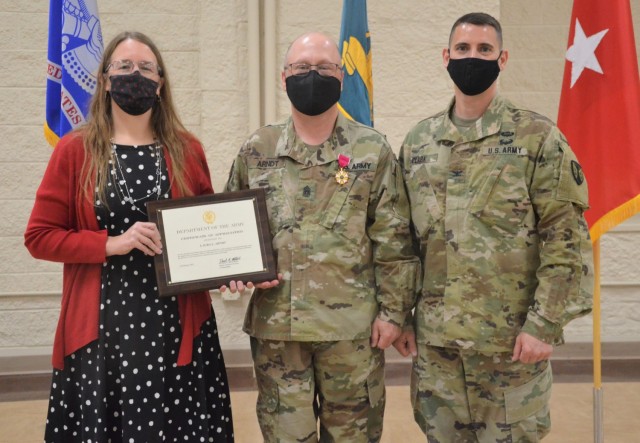 Laura Arndt, spouse of Command Sgt. Maj. Daniel Arndt, was awarded a certificate of appreciation for her contributions supporting the LOGCAP Support Brigade. Col. Michael Clark, LSB commander, presented her with the award during a change of...
