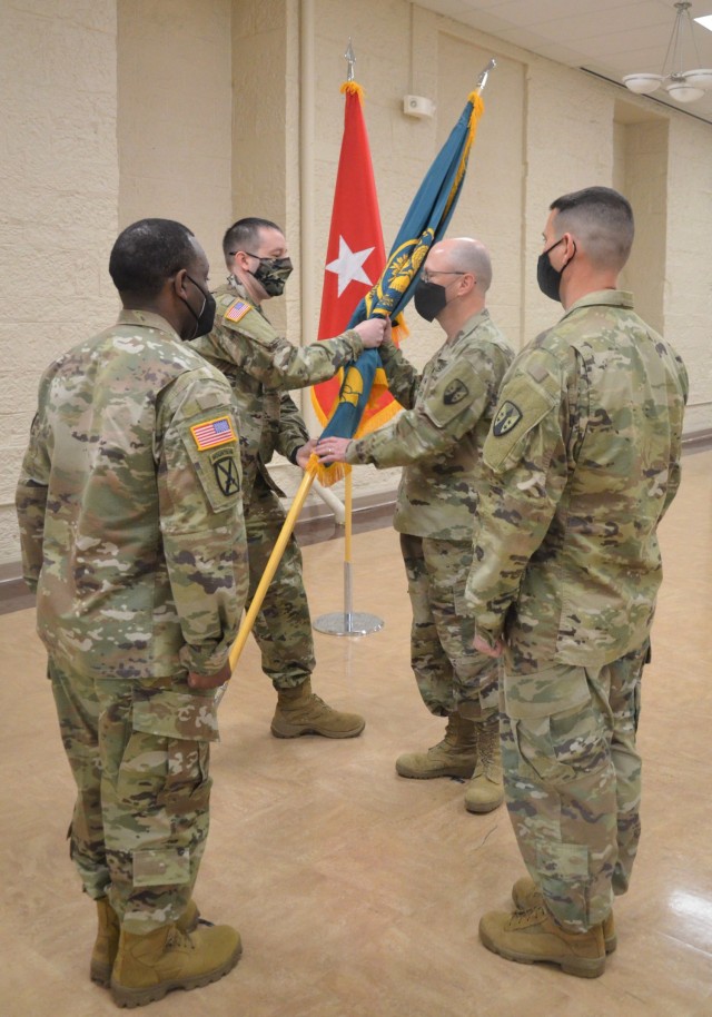 Command Sgt. Maj. Daniel Arndt receives the guidon for the last time as the senior enlisted leader of the LOGCAP Support Brigade during a change of responsibility ceremony held at Rock Island Arsenal, Illinois, April 10. (Photo by Staci-Jill...