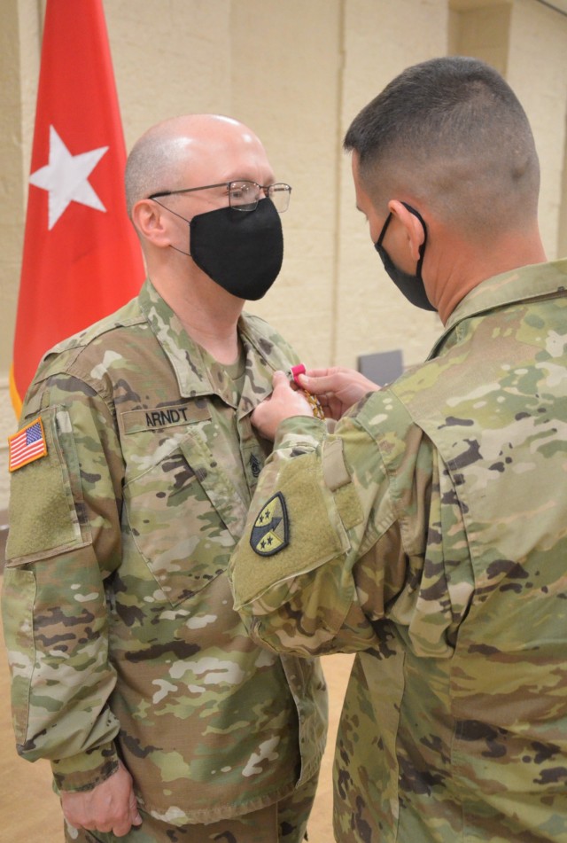 Command Sgt. Major Daniel Arndt is awarded the Legion of Merit by LOGCAP Support Brigade Commander Col. Michael Clark during a change of responsibility ceremony held at Rock Island Arsenal, Illinois, April 10. (Photo by Staci-Jill Burnley, ASC...
