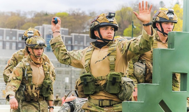 A member from the U.S. Air Force Academy team (above) throws a grenade while the group runs through the Crucible Challenge at the 52nd Sandhurst Military Skills Competition April 17. USAFA performed with great intensity as it ranked third in the Sandhurst relay leaving USMA Black in fourth place and the U.S. Naval academy team in fifth place at that juncture. USAFA finished eighth overall at Sandhurst.