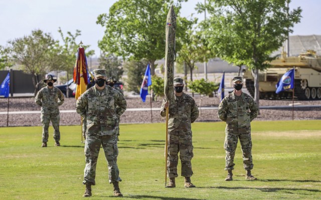 The 2nd Armored Brigade Combat Team, ‘The Iron Brigade’, 1st Armored Division uncased their unit colors during a ceremony on Iron Soldier Field April 22. The ceremony marked the end of their deployment in support of Operation Spartan Shield and reintegration back into the Fort Bliss community. (U.S. Army Photo by: Staff Sgt. Michael West)