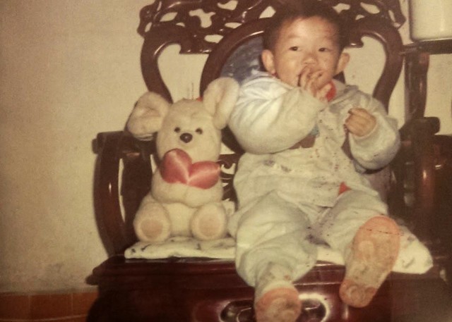 Army Reserve Spc. Feiyu He, seen here as a toddler, deployed to Camp Arifjan, Kuwait, with the Lancaster, Pennsylvania-based 1185th Deployment and Distribution Support Battalion. The Chinese-born He is applying for U.S. citizenship with the support of the 1st Theater Sustainment Command's operational command post. (Photo courtesy of Feiyu He)