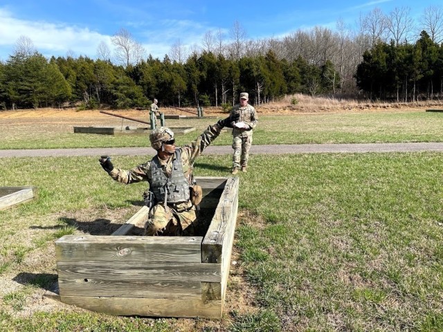 Spc. James Spoerl, human resources specialist, 1st Theater Sustainment Command, throws a practice grenade during the Best Warrior Competition at Fort Knox, Kentucky, March 30, 2021. The Best Warrior Competition challenges Soldiers of all ranks to display their knowledge of Soldier competencies through a series of physical and mental challenges. (U.S. Army photo by Staff Sgt. Godot G. Galgano, 1st TSC Public Affairs)