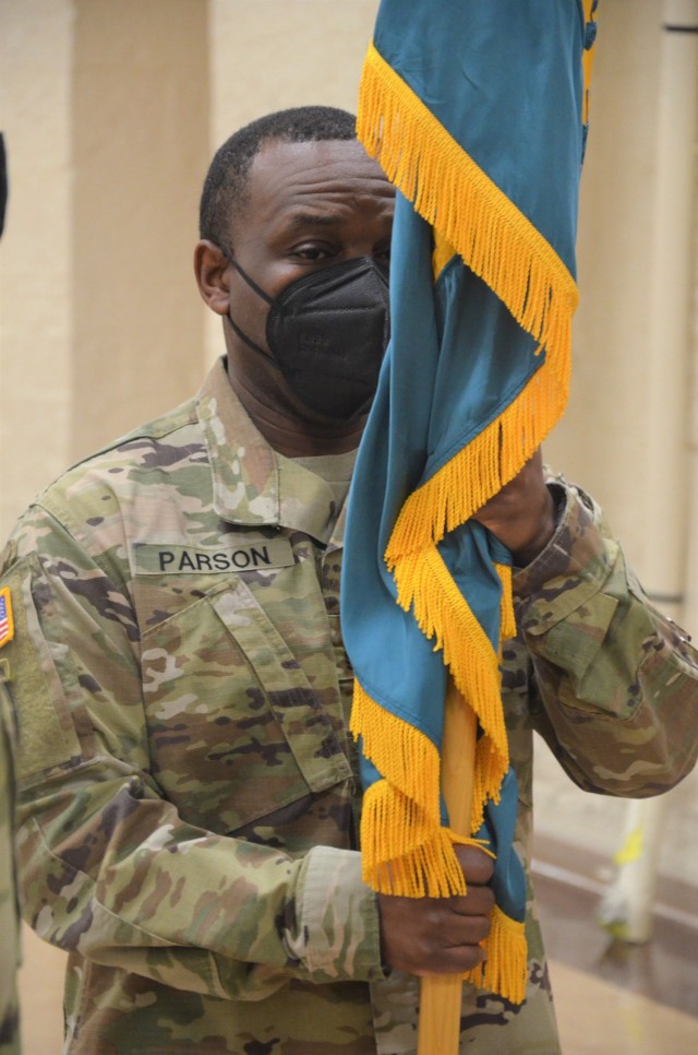 Command Sgt. Maj. Marcel Parsons accepts the guidon and officially becomes the command sergeant major of the LOGCAP Support Brigade during a change of responsibility ceremony held at Rock Island Arsenal, Illinois, April 10. (Photo by Staci-Jill...