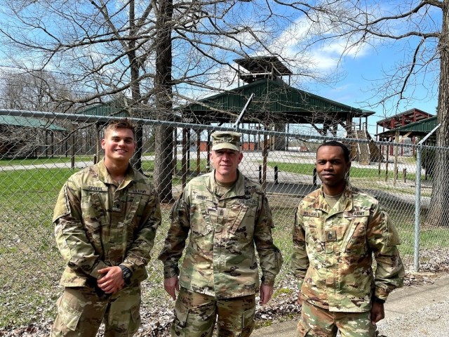 Spc. James Spoerl (left), human resources specialist, 1st Theater Sustainment Command, Command Sgt. Maj. Michael Perry (center), 1st Theater Sustainment Command’s senior enlisted advisor, and Staff Sergeant Nahjier Williams (right), public...