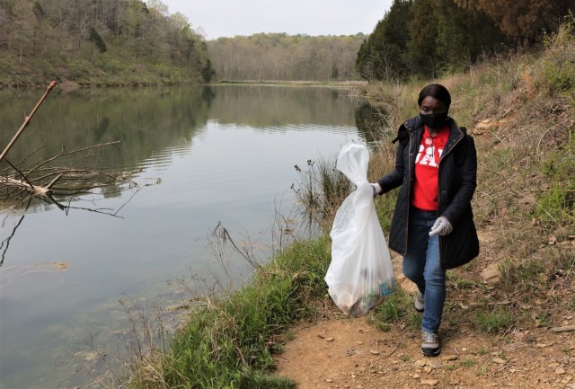 Members of the U.S. Army Recruiting Command, together with Family members and volunteers hiked through outdoor areas at and around Fort Knox April 23 to honor Earth Day and remove any trash.