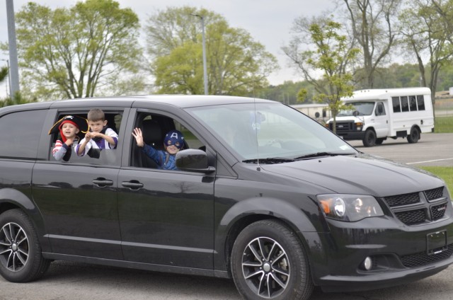 Costumed children take in the sights and sounds of Kidsfest: Magical Drive-thru, hosted April 17 at the division parade field.