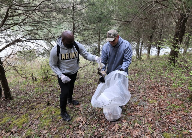 Members of the U.S. Army Recruiting Command, together with Family members and volunteers hiked through outdoor areas at and around Fort Knox April 23 to honor Earth Day and remove any trash.