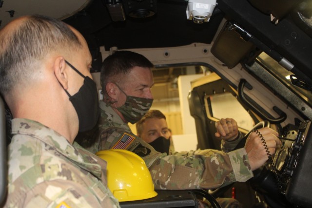 Gen. James McConville, the 40th Chief of Staff of the U.S. Army (right), examined a vehicle at the Ordnance School’s Cohen Hall Thursday, April 22, 2021 at Fort Lee, Va. McConville visited the Army post reviewing Combined Arms Support...