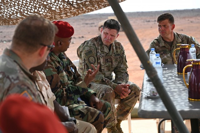 U.S. Army Maj. Gen. Joel K. Tyler, J-3 director of operations, U.S. Arica Command meets with Djiboutian Col. Dahir Hassan Abadid, commander of Armored Regiment and Djiboutian Maj. Mohamed Assowen, commander of the Rapid Intervention Battalion (RIB) while watching a live-fire exercise conducted by the RIB, Sept. 28, 2020. The RIB’s mission is to serve as a reactionary force to accomplish specific tasks directed by their higher command in the Djiboutian army. (U.S. Air Force photo by Staff Sgt. Dana J. Cable)