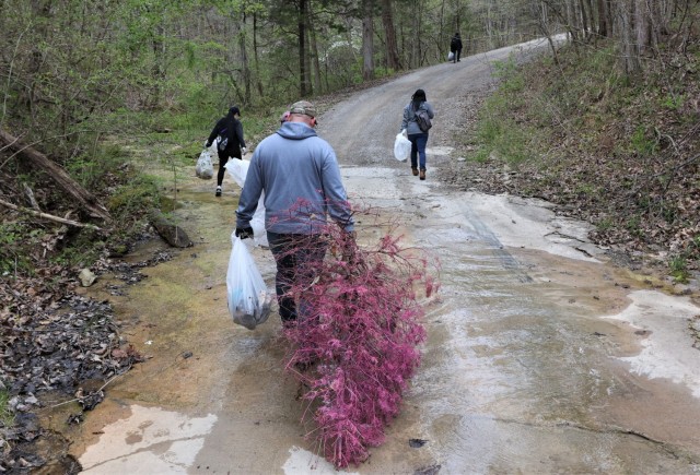 Members of the U.S. Army Recruiting Command, together with Family members and volunteers hiked through outdoor areas at and around Fort Knox April 23 to honor Earth Day and remove any trash.