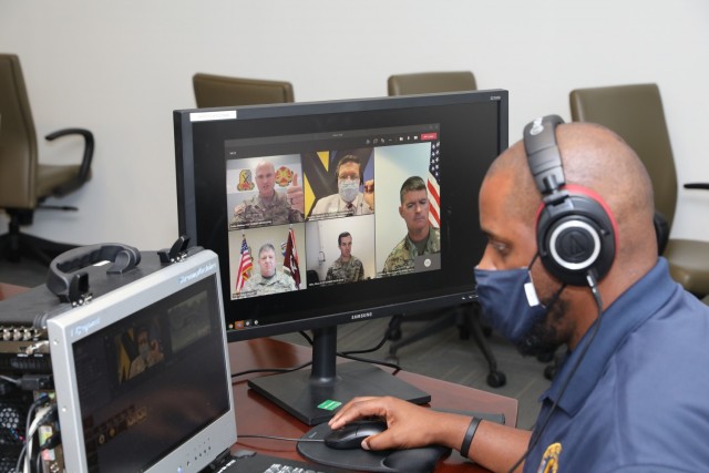 Director Charles Gilbert works the Facebook town hall through MSTeam April 20 in the Maneuver Center of Excellence Public Affairs Conference Room.